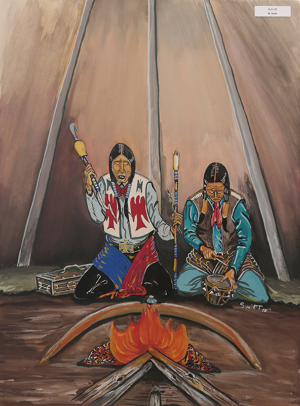 Ceremony around fire inside tipi