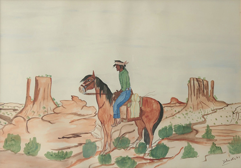 Navajo man on horse in desert